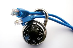 An ethernet cable is run through a lock. This can represent internet safety, virus, firewall or network protection.